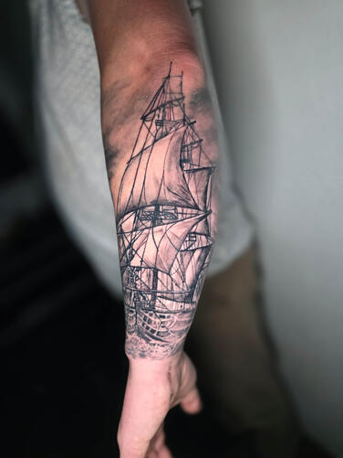Black and gray realism ship tattoo fully healed forearm detail by Efren Tattoos Del Rio Texas